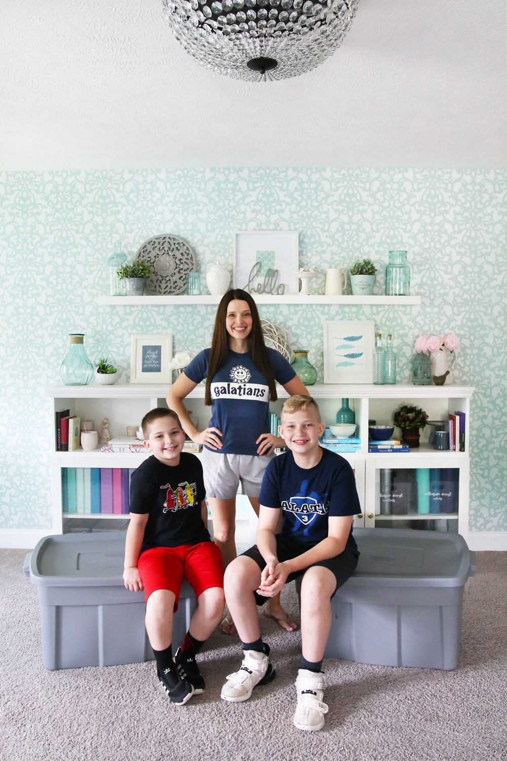 Mom and two sons packing for summer camp