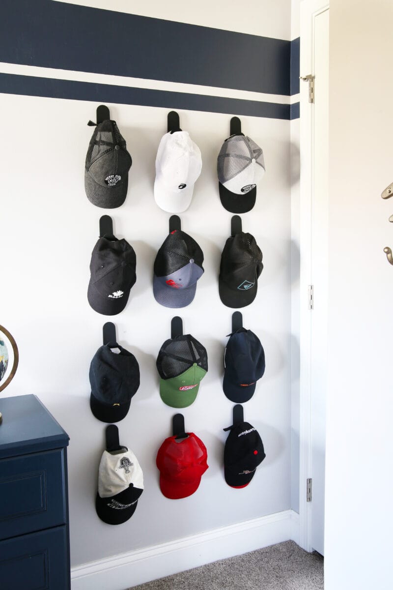 Organized hat wall in a shared boys' bedroom