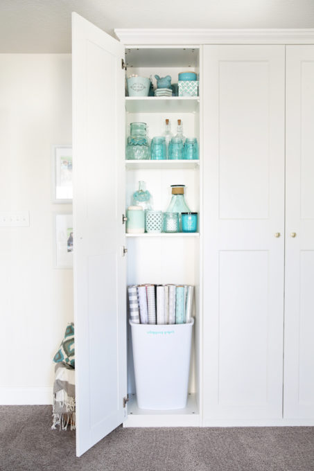 This super helpful post talks about IKEA's 3 best storage systems-- ALGOT, BESTA, and PAX-- and gives great ideas for using them in your home! | IKEA BESTA storage system, modular storage system, IKEA ALGOT closet system, custom closet system, IKEA PAX wardrobe system, DIY wardrobe, IKEA hack, how to plan for and install IKEA storage systems, built in storage unit for home office made with IKEA PAX wardrobe system and custom trim work, GRIMO doors, aqua knick knack storage