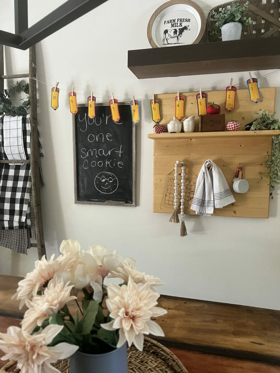 Cloths pins holding up DIY pencil fabric being used as a countdown to the first day of school