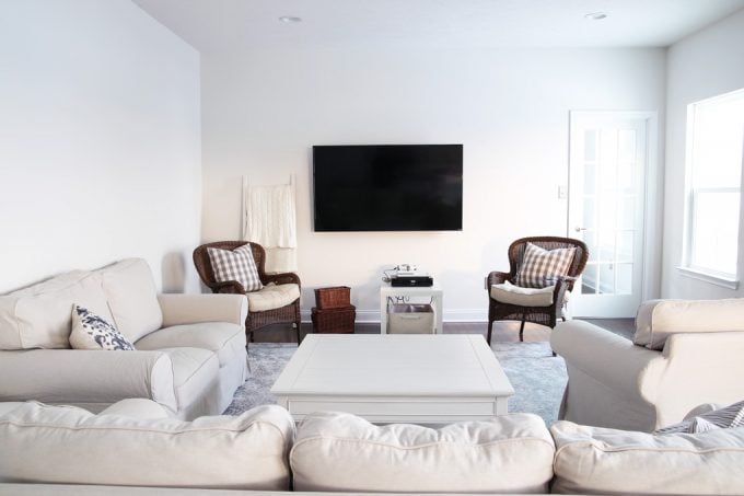 living room with furniture and the tv mounted on the wall before the BESTA system has been installed