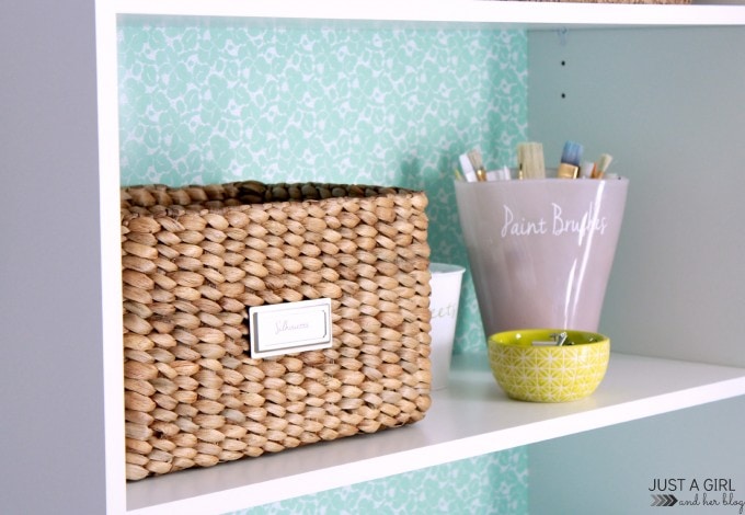 a basket and cup labeled with supplies