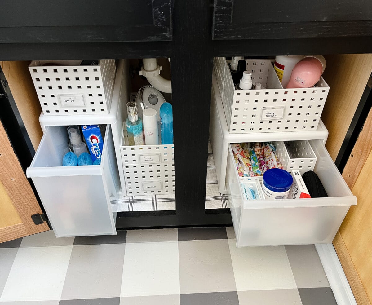 drawers under a black vanity in the bathroom under the sink from Small Stuff Counts