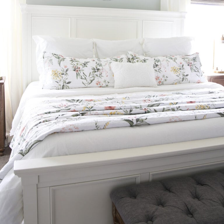 White Bed with Spring Floral Bedding