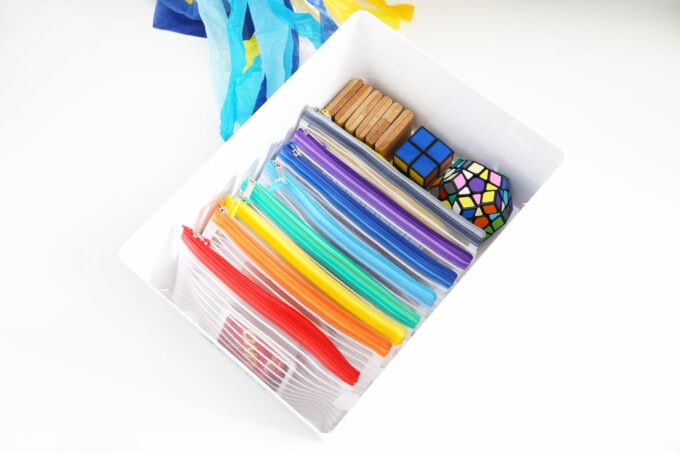 zippered card pouches in plastic storage bin