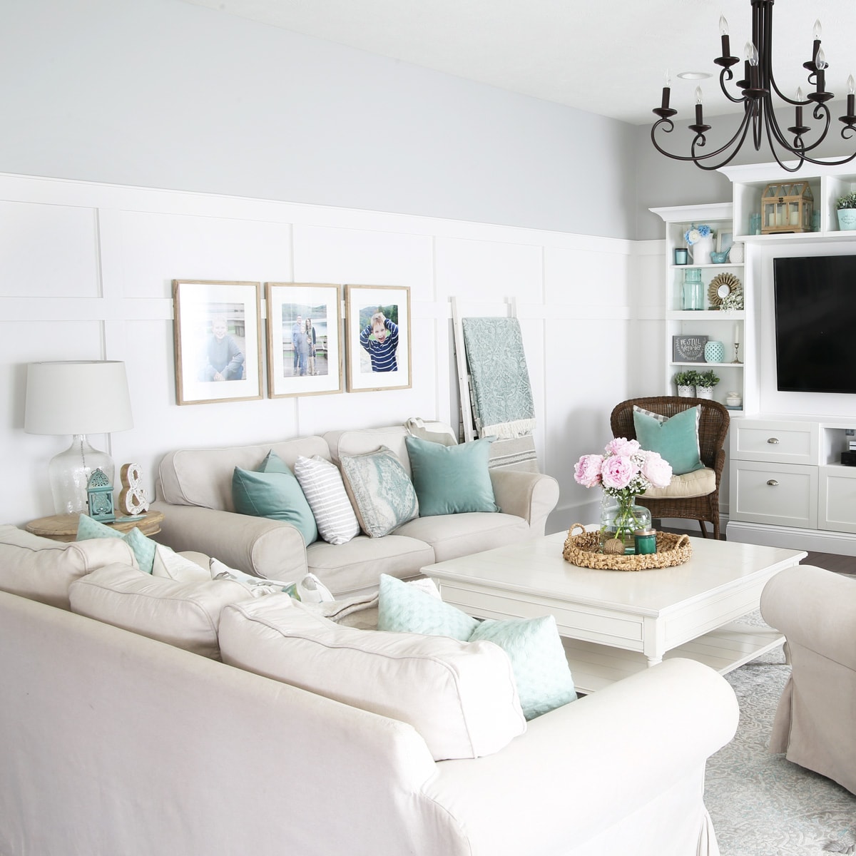 Board and Batten Wall Treatment in a Neutral Living Room with Aqua Accents