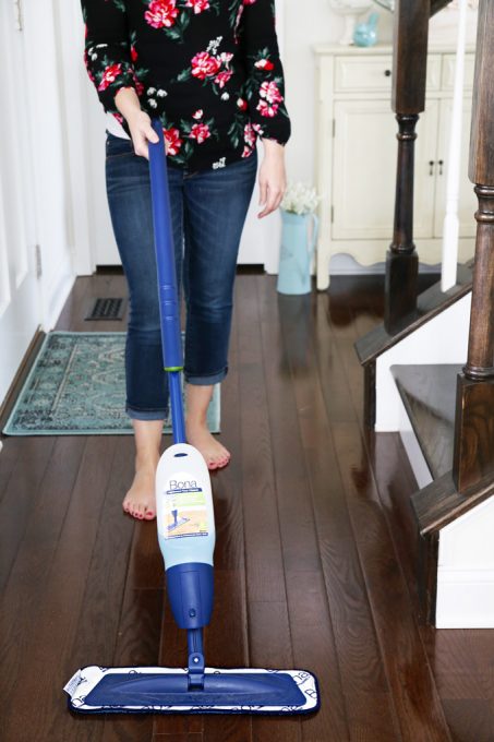 Abby mopping the hardwood floors