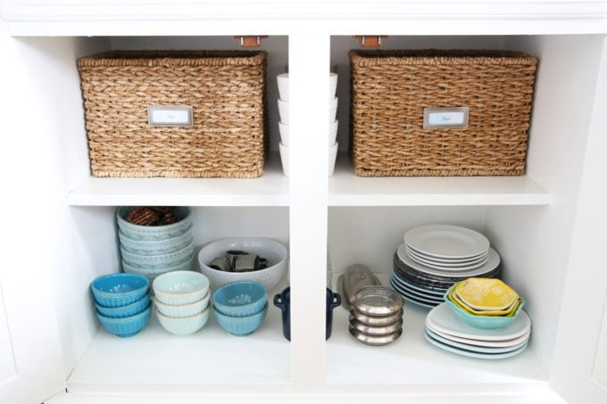 Organized Cabinets with Plates, Bowls and Baskets in the Dining Room