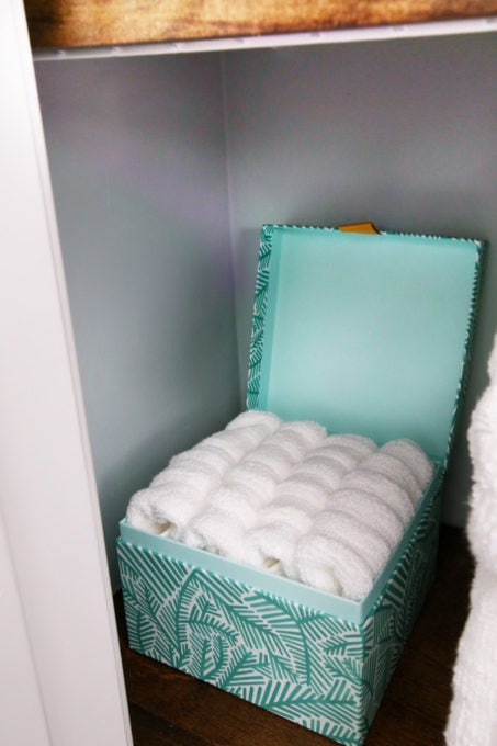 Washcloths Stored in a Small Box in a Small, Organized Linen Closet