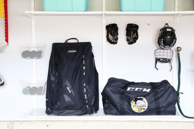 Organized Hockey Equipment Drop Zone in Garage