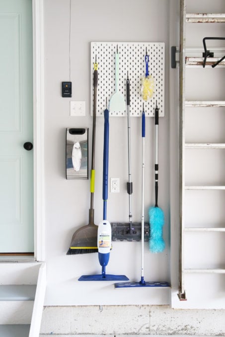 Brooms and Mops Stored on an IKEA SKADIS Pegboard with Hooks