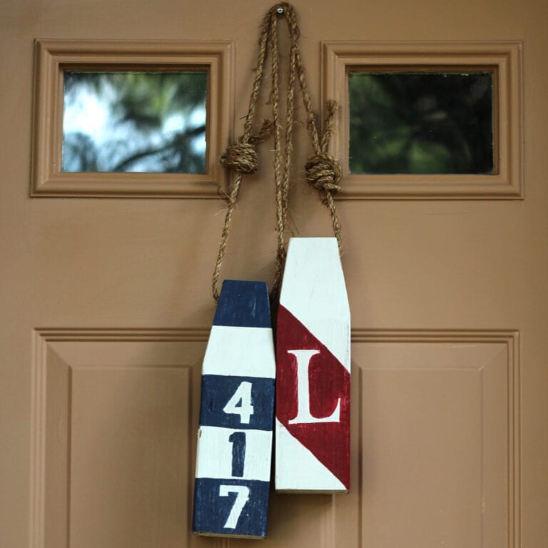 Two DIY Buoys, Used as an Alternative to a Wreath on the Front Door