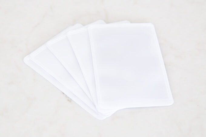 Adhesive business card holders