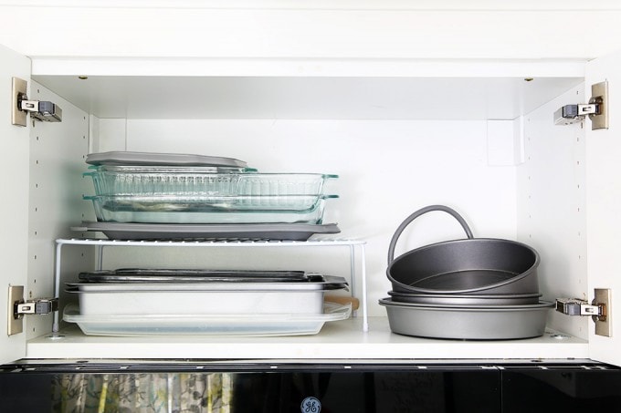 Awesome tips and tricks for organizing a small kitchen-- and proof that small kitchens can be beautiful too! Click through to the post for her amazing organization tips!