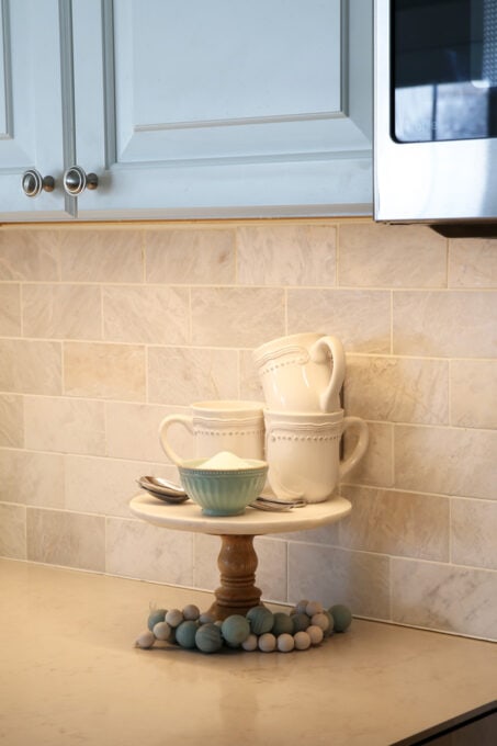 Cake stand and under cabinet lighting in the kitchen