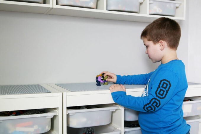 young boy using DIY LEGO table