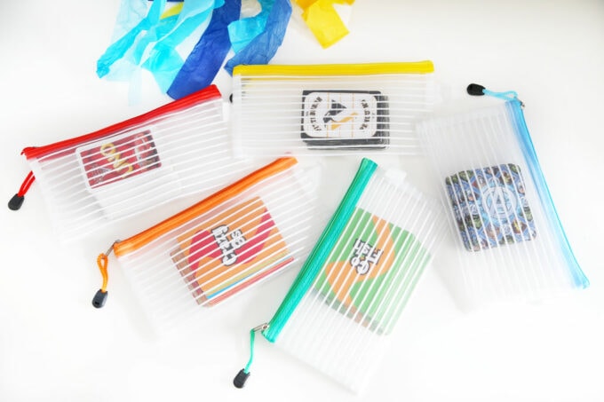 Playing cards in rainbow zipper pouches for organized card games 