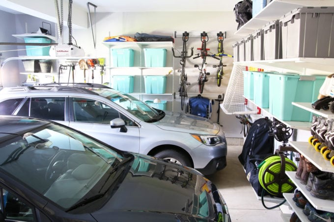 Organized Garage with Two Cars Parked Inside