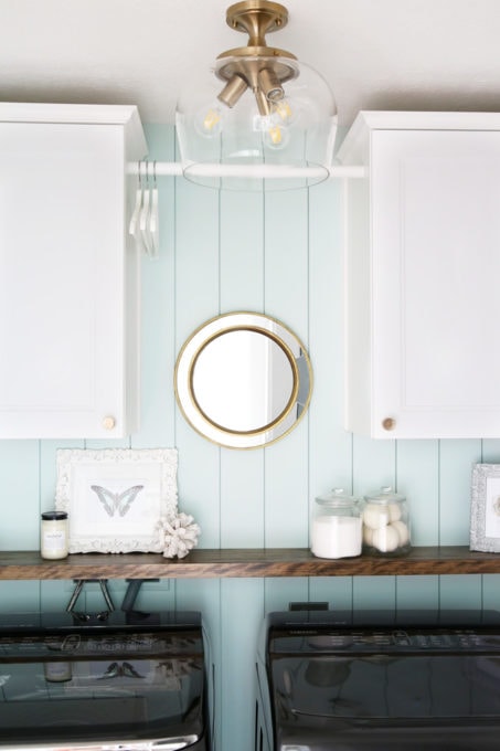 Small Laundry Room Organized with Hanging Rod for Clothes