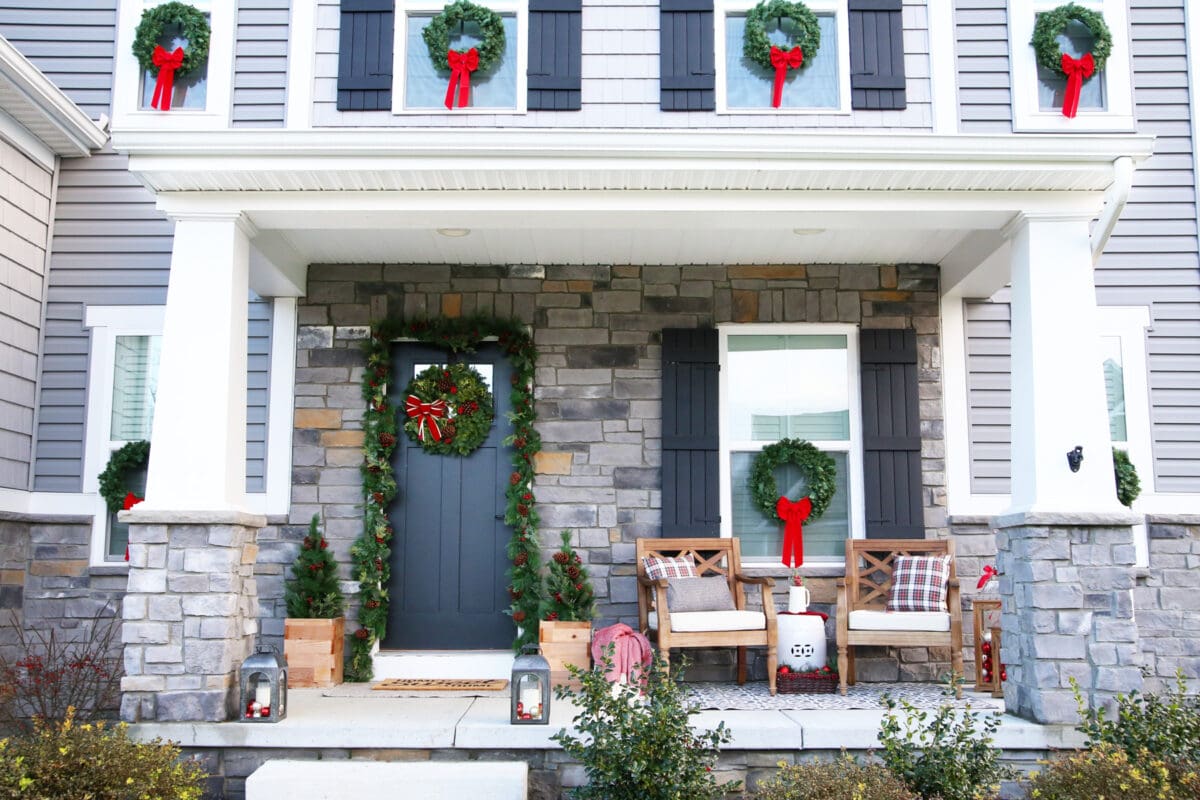 Front Porch Decorated for Christmas with Garland Around the Front Door