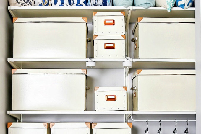 Bins in a closet for rotating clothes, organized closet