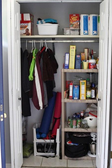 coat closet with messy pantry shelf