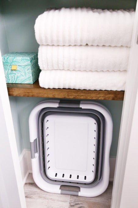 Collapsible Laundry Baskets Organized in a Small Linen Closet