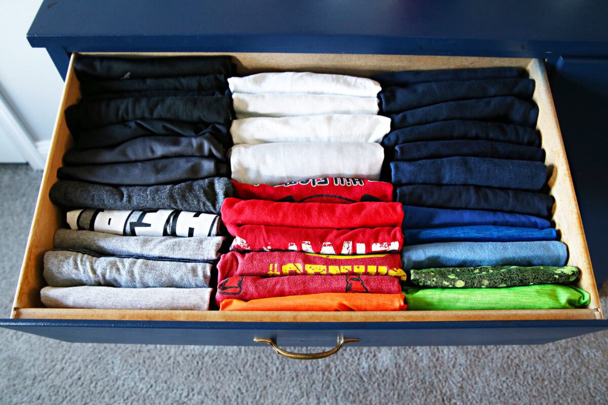 Drawer full of neatly folded hand-me-down clothes