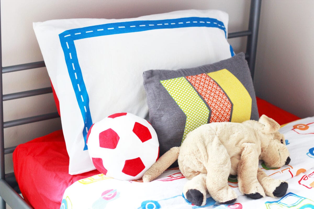 Pillows and Stuffed Toys Laying on a Child's Bed