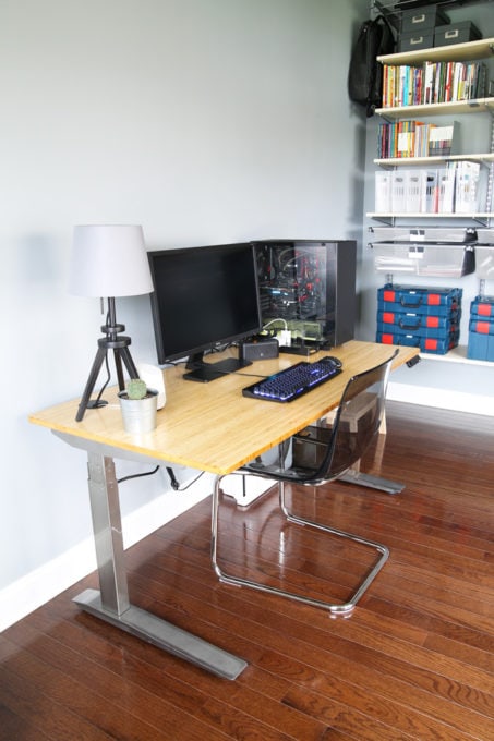 a sit and stand computer desk with a chair