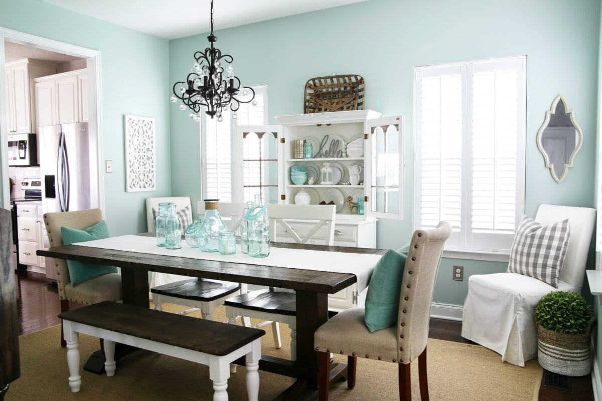 Aqua dining room with wood shutters