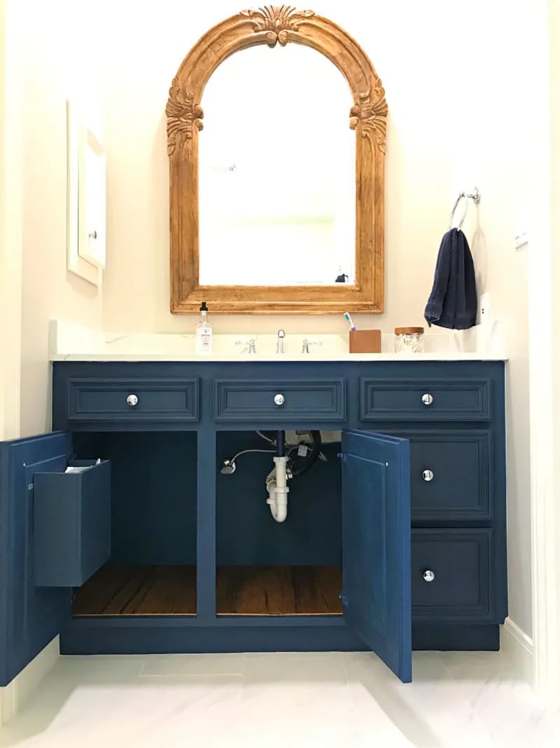 Navy blue bathroom vanity with DIY Cabinet Door Trash Can Garbage from Abbotts at home