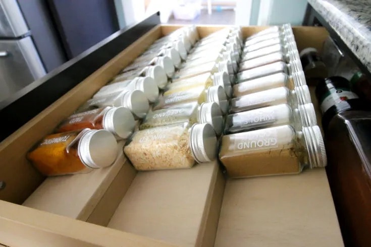 Build a simple wooden spice drawer organizer to see all your spices easily without them sliding around