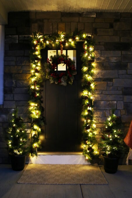 Outdoor Christmas Garland Around the Front Door at Night