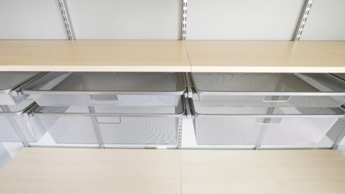 Platinum drawers and sand shelves from an Elfa shelving unit from The Container Store