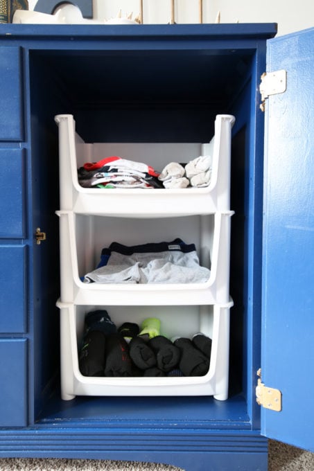 Stacking Plastic Pantry Bins Used to Organize Clothes and Provide Vertical Storage