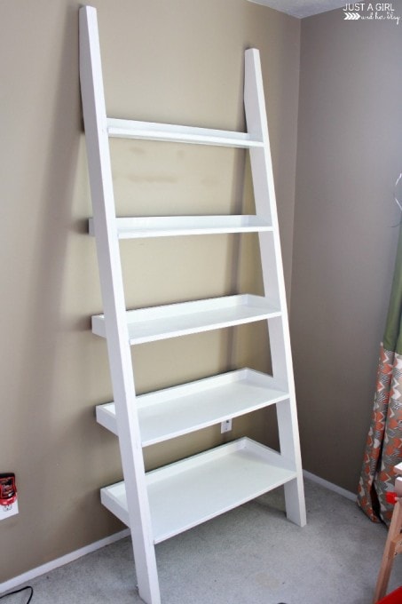 tall white ladder shelf after all the toys were taken off