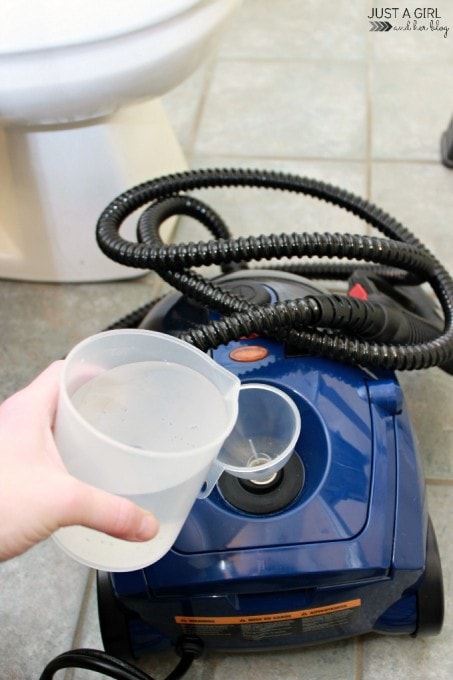 Filling the steamer with a cup of water