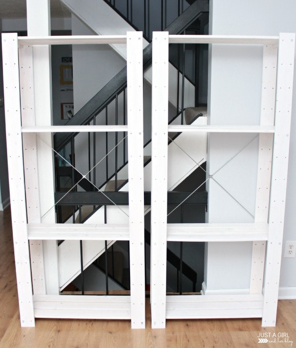 large toy storage shelves after painting them white