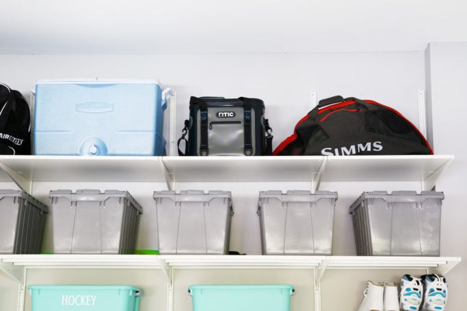 Fishing Gear Stored in Bins in an Organized Garage