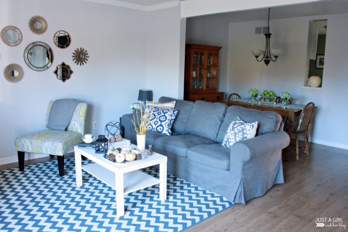 the living room with a couch, chair, and table