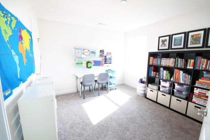 Organized kids' playroom with an art area and toy storage