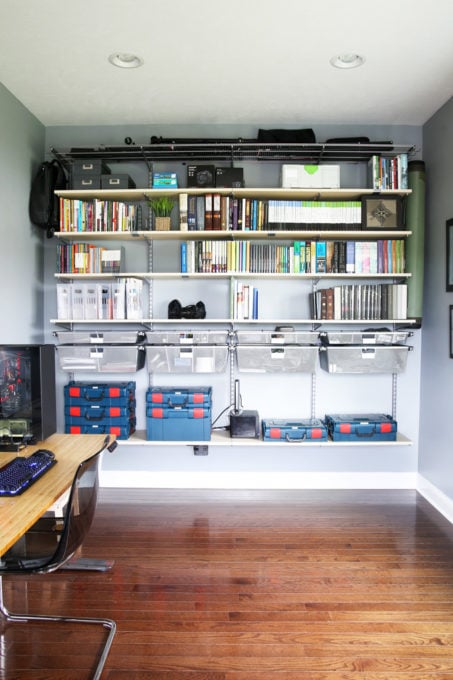 several rows of shelving hanging on the wall that has been organized