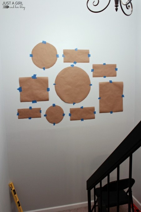 paper taped to the wall to create a mockup of what the gallery wall will look like