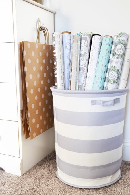 Organized Wrapping Paper in a Round Fabric Storage Bin