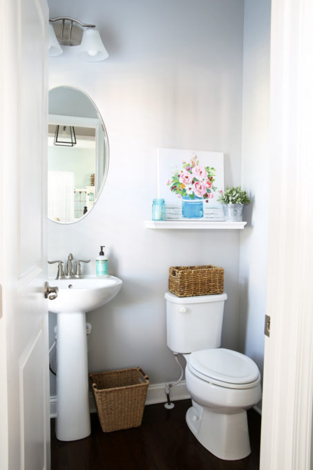 Half Bathroom Refresh with Gray Walls and a Floral Painting