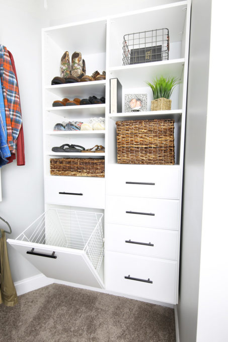 Hidden hamper in organized primary closet, closet ideas