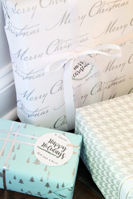 close up of presents with printable gift tags attached by ribbon