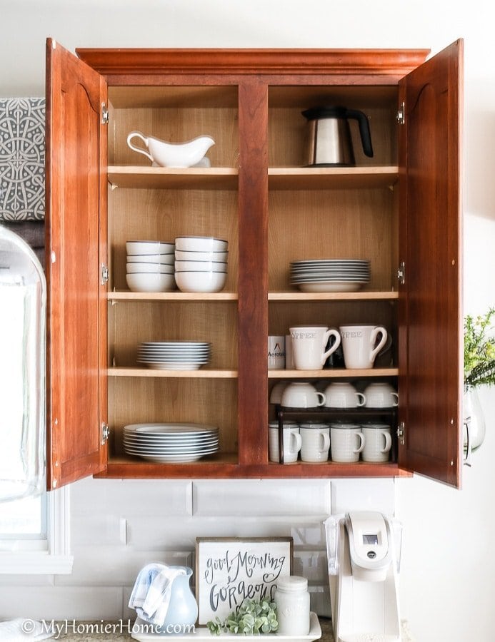 Organized kitchen cabinets with a drink shelf from My Homier Home, organized storage ideas for small kitchens