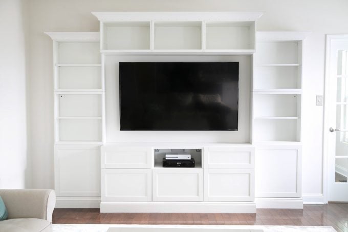 custom besta system with moulding around the tv